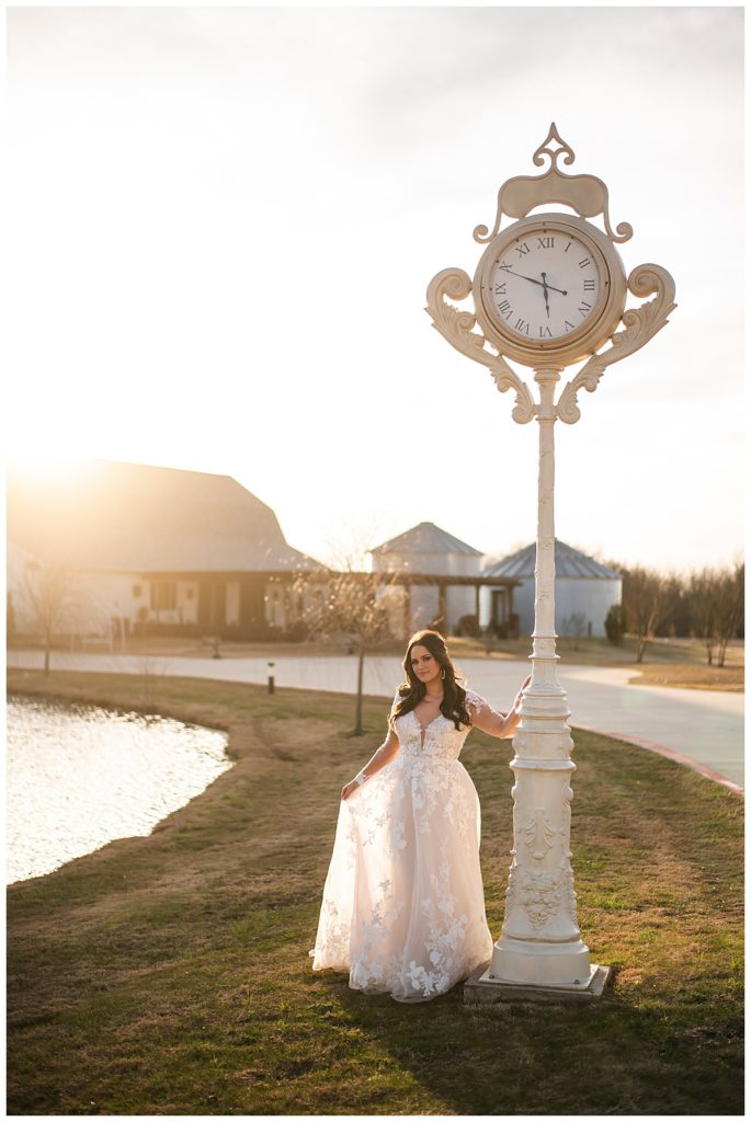 Bride by the clock at One Preston Event Venue at sunset