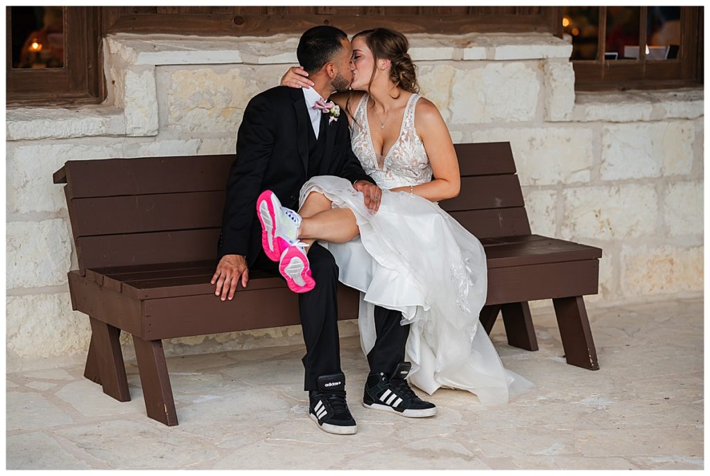 Bride and groom with tennis shoes on 