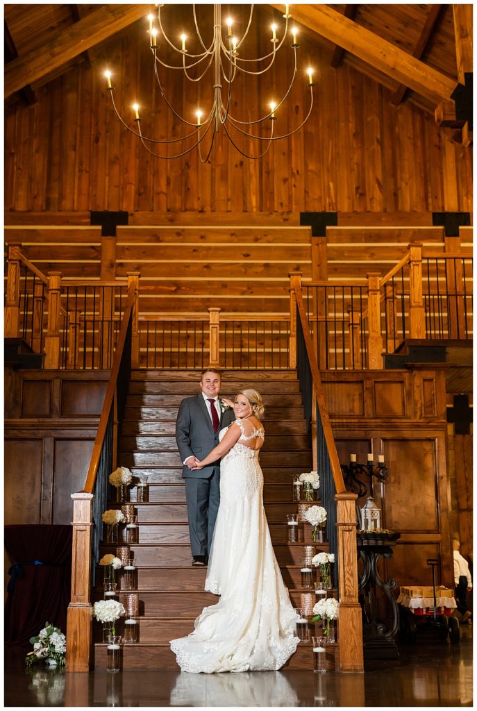 Bride and Groom on staircase at The Lodge Denton 