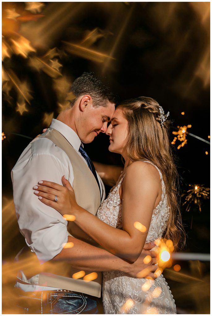 sparkler photo with bride and groom 