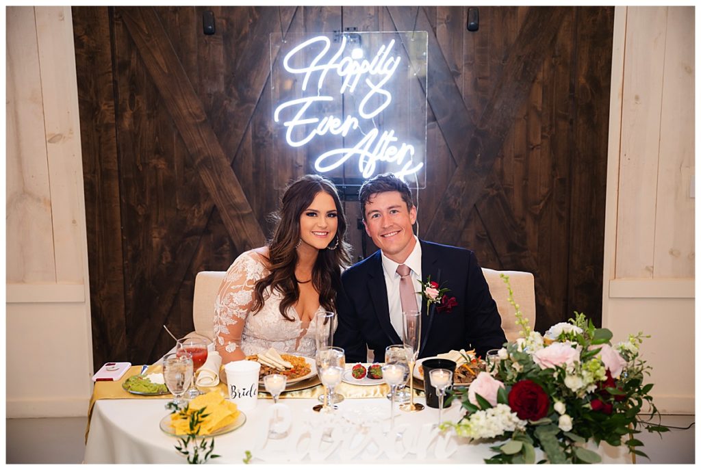 bride and groom at sweetheart table