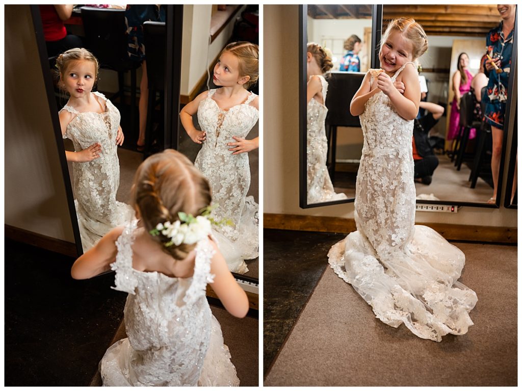 Young daughter in mom's wedding dress